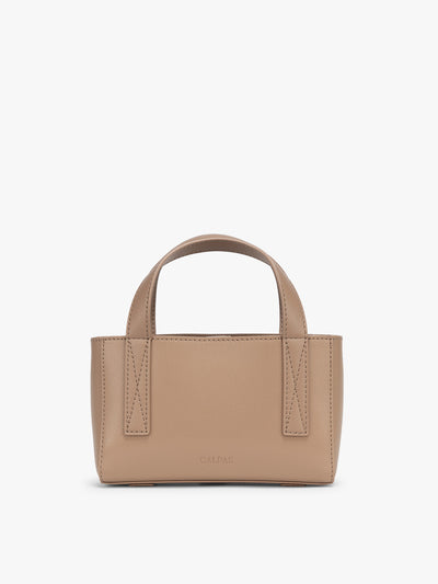 CALPAK Haven Mini Crossbody Bag in beige Taupe front view; AMC2501-TAUPE