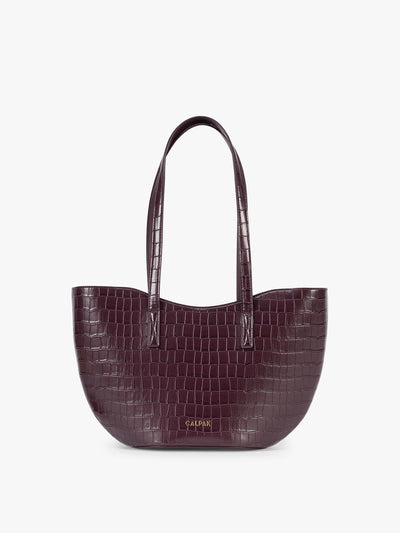 A CALPAK Haven Tulip Tote in Dark Cherry dark plum purple crocodile-embossed leather tote bag with double shoulder straps  against a plain white background ; AHP2601-DARK-CHERRY-FAUX-CROC