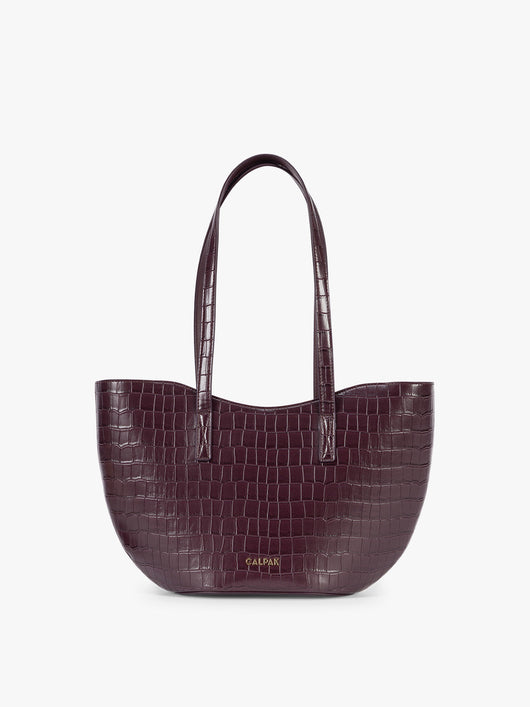 A CALPAK Haven Tulip Tote in Dark Cherry dark plum purple crocodile-embossed leather tote bag with double shoulder straps  against a plain white background ; AHP2601-DARK-CHERRY-FAUX-CROC