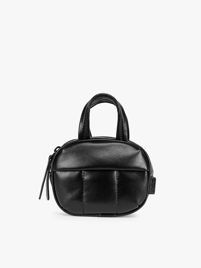 A Black Mushroom vegan leather top-handle CALPAK Luka Zip Bag Charm with a zippered front pocket and a small side strap, shown against a plain white background; ALK2501-BLACK-PU
