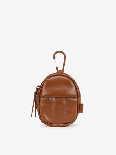 A small light Honey Brown CALPAK Luka Backpack Zip Bag Charm leather backpack keychain with a top carabiner and zipper pull, shown on a plain white background; AMB2201-HONEY-BROWN-PU