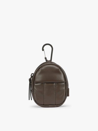 A small brown Mushroom CALPAK Luka Backpack Zip Bag Charm leather backpack keychain with a top carabiner and zipper pull, shown on a plain white background; AMB2201-MUSHROOM-PU