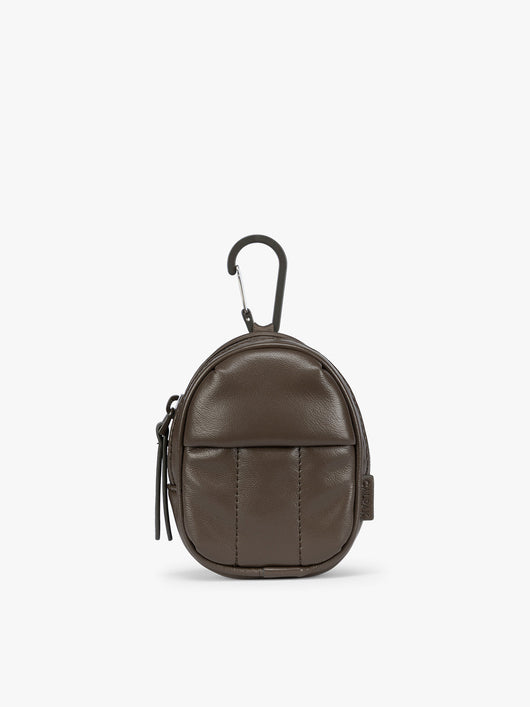 A small brown Mushroom CALPAK Luka Backpack Zip Bag Charm leather backpack keychain with a top carabiner and zipper pull, shown on a plain white background; AMB2201-MUSHROOM-PU