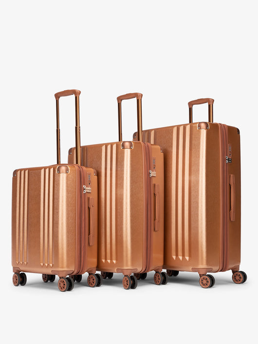 CALPAK Ambeur 3 piece lightweight durable copper hard shell luggage set with carry-on; LAM3000-COPPER