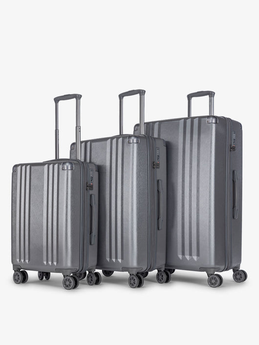 CALPAK Ambeur 3 piece lightweight durable copper hard shell luggage set with carry-on, medium luggage and large luggage in gunmetal; LAM3000-GUNMETAL