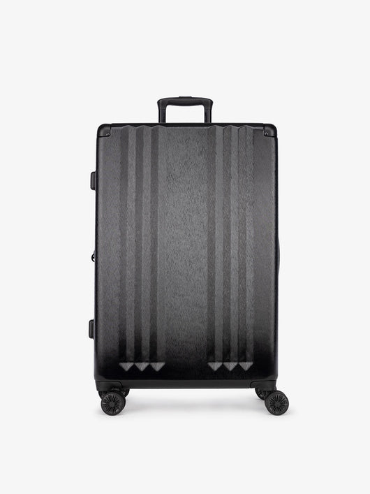 Studio product shot of front-facing CALPAK Ambeur large 30-inch black hardshell spinner luggage; LAM1028-BLACK