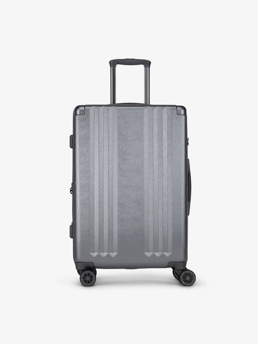 Studio product shot of front-facing CALPAK Ambeur medium 26-inch lightweight hardshell luggage with 360 spinner wheels in gunmetal; LAM1024-GUNMETAL