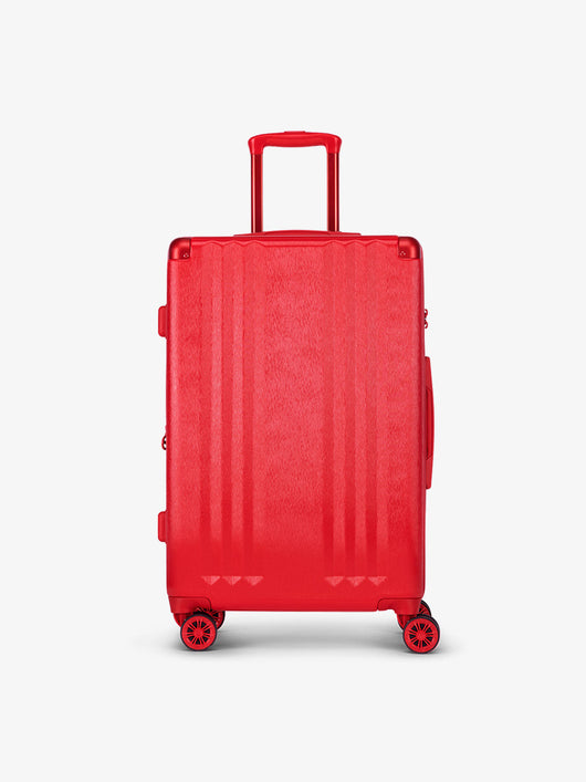Studio product shot of front-facing CALPAK Ambeur medium 26-inch lightweight hardshell luggage with 360 spinner wheels in metallic red; LAM1024-METALLIC-RED