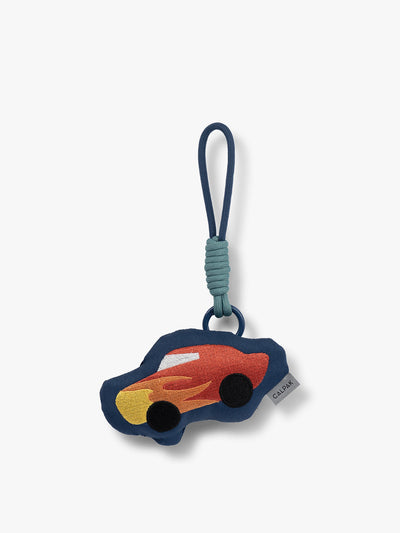 CALPAK Kids Pluffy Bag Charm red Car with flames on dark blue plush front view; APLF2501-CAR