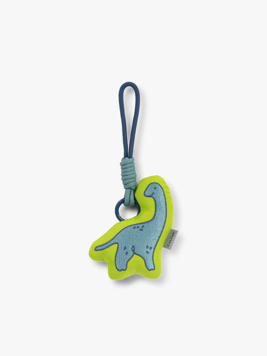CALPAK Kids Pluffy Bag Charm blue Dinosaur on light green plush front view; APLF2501-DINOSAUR