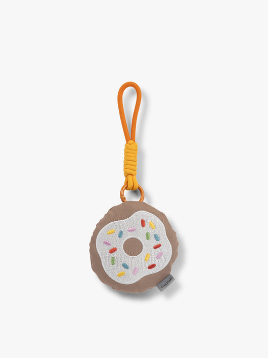 CALPAK Kids Pluffy Bag Charm white Donut with sprinkles on tan plush front view; APLF2501-DONUT