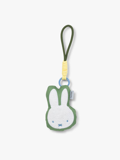 Plush Miffy x CALPAK Pluffy Bag Charm keychain with a green border and Miffy on a white background; APLF2501-GREEN-MIFFY