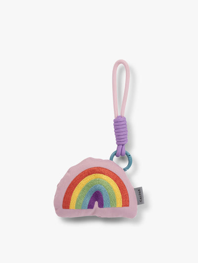 CALPAK Kids Pluffy Bag Charm colorful Rainbow on pink plush front view; APLF2501-RAINBOW
