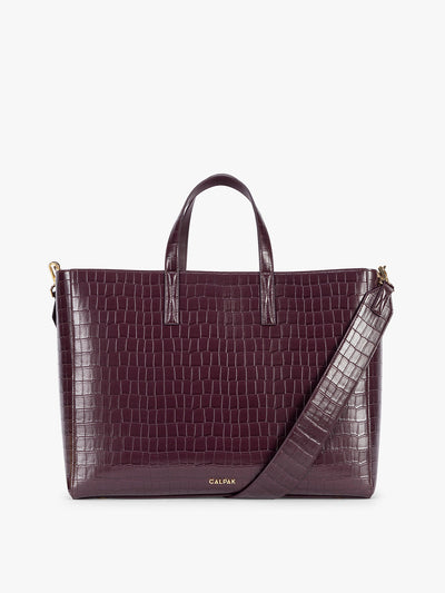 CALPAK Haven 16" Laptop Tote in Dark Cherry deep red crocodile-embossed tote bag with top handles and a detachable shoulder strap, shown against a plain white background; ATO2102-DARK-CHERRY-FAUX-CROC