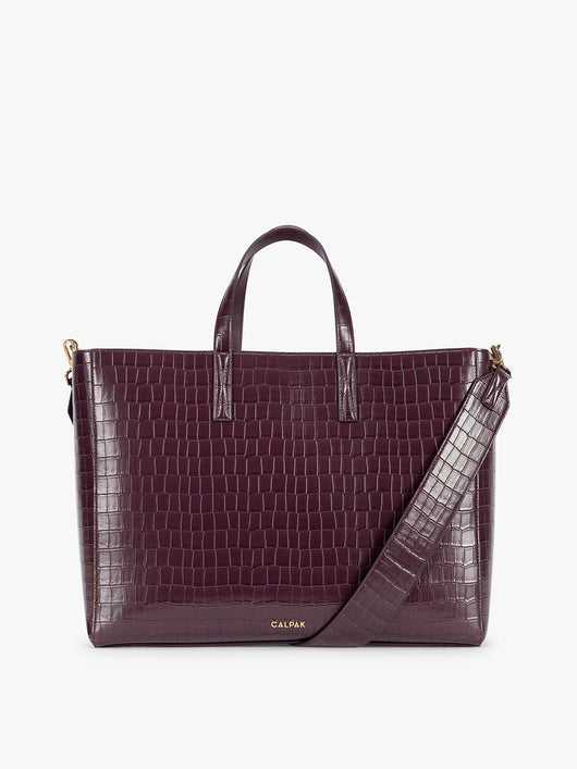 CALPAK Haven 16" Laptop Tote in Dark Cherry deep red crocodile-embossed tote bag with top handles and a detachable shoulder strap, shown against a plain white background; ATO2102-DARK-CHERRY-FAUX-CROC