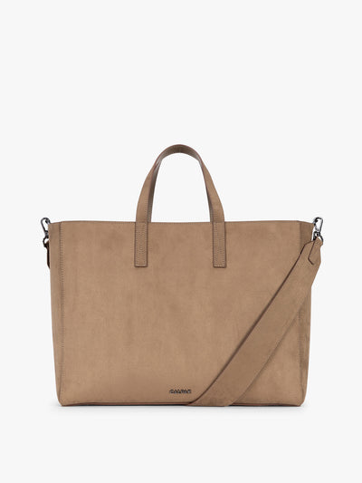 A CALPAK Haven 16" Laptop Tote in Truffle Suede taupe brown tote bag with dual top handles and a matching adjustable shoulder strap, shown against a plain white background; ATO2102-TRUFFLE-FAUX-SUEDE