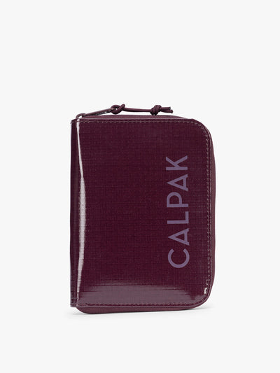  CALPAK Terra Zip Passport Wallet in dark red Dark Cherry on a white background; ATPW2501-DARK-CHERRY
