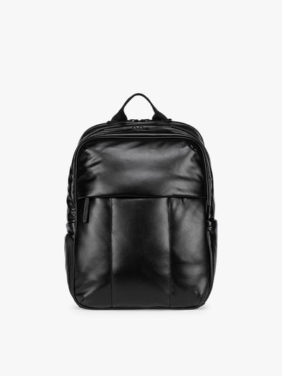 Black CALPAK Luka 15 inch Laptop Backpack in vegan leather with a glossy finish, featuring a top carry handle, a main zippered compartment, and a front slip pocket, shown against a plain white background; BPL2001-BLACK-PU