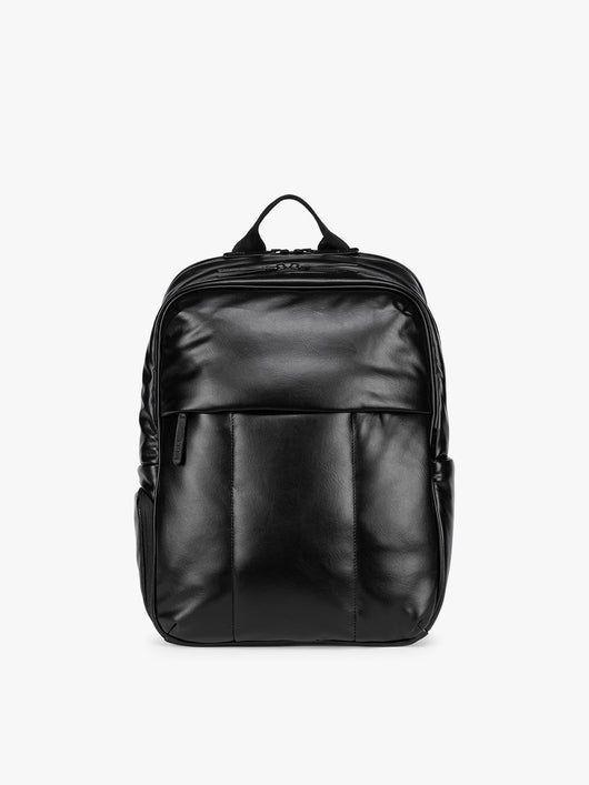 Black CALPAK Luka 15 inch Laptop Backpack in vegan leather with a glossy finish, featuring a top carry handle, a main zippered compartment, and a front slip pocket, shown against a plain white background; BPL2001-BLACK-PU