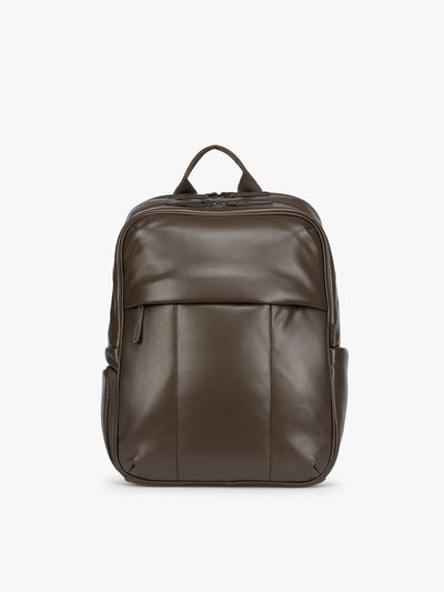 CALPAK Mushroom brown Luka 15 inch Laptop Backpack in vegan leather with a glossy finish, featuring a top carry handle, a main zippered compartment, and a front slip pocket, shown against a plain white background; BPL2001-MUSHROOM-PU