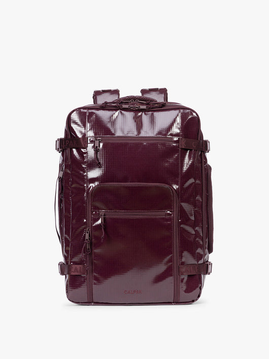 CALPAK Terra 35L Laptop Backpack Duffel in dark red Dark Cherry with tan accents on a white background; BPTL2601-DARK-CHERRY