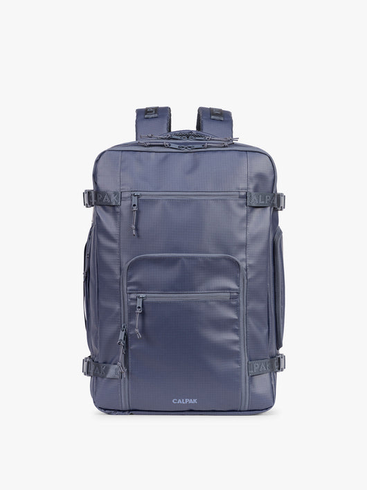 CALPAK Terra 35L Laptop Backpack Duffel in matte dark blue Indigo with tan accents on a white background; BPTL2601-INDIGO