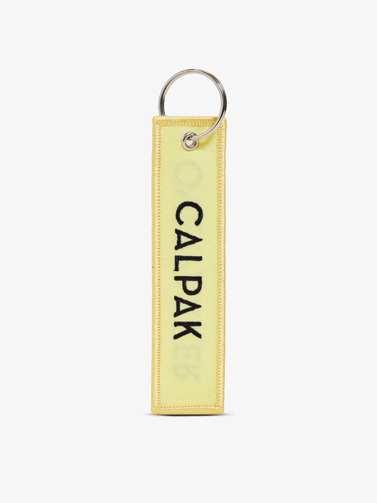 Gif of front-view and back-view of CALPAK Overpacker Luggage Tag in yellow; CPK2401-PATCH