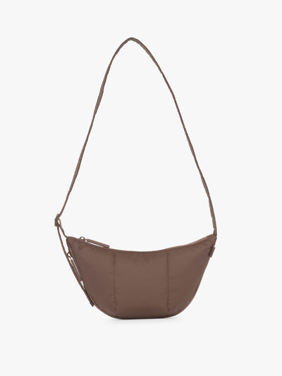 CALPAK Luka Crescent Tote bag in brown Walnut with shoulder strap and bag is expandable up to 2" on a white background; CBL2601-WALNUT