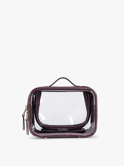 CALPAK Small Clear Cosmetics Case that is a transparent pouch with a deep red Dark Cherry in crocodile-embossed; CCM2001-DARK-CHERRY-FAUX-CROC
