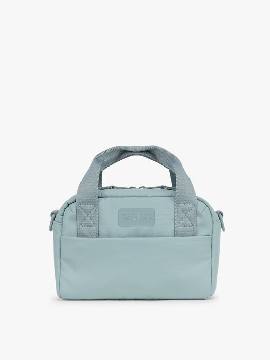CALPAK Connect Crossbody Bag in light blue Bluebell with a visible brand logo on a white background; CCN2501-BLUEBELL