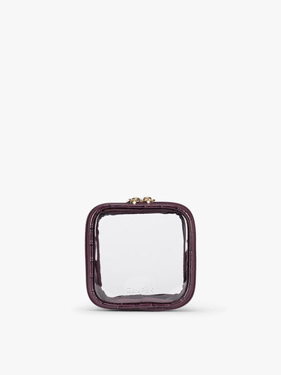 CALPAK Tiny Clear Cosmetics Case that is a transparent pouch with a deep red Dark Cherry in crocodile-embossed; CCT2501-DARK-CHERRY-FAUX-CROC
