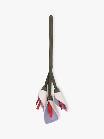 CALPAK Colette Calla Lilly Bag Charm with dark green strap and Red tomato flower stem with white and purple petals; CLBC2601-LAVENDER
