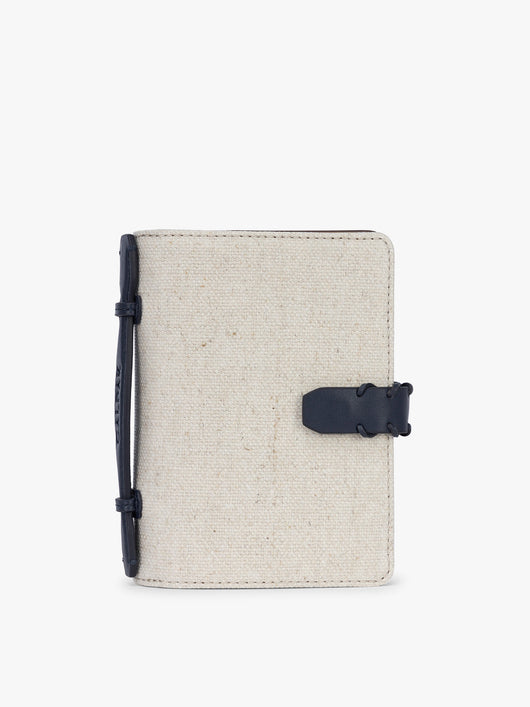 CALPAK Colette Multi Passport Wallet in beige canvas material and blue finishings in Natural Navy; CLPW2601-NATURAL-NAVY