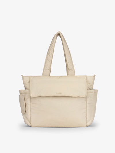 CALPAK Diaper Tote Bag with Laptop Sleeve made with durable, recycled, water-resistant material and a magnetic front pocket closure in oatmeal; TBB2401-OATMEAL