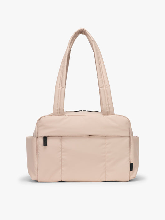 CALPAK Mini Duffel in light pink Rose Quartz with puffy exterior, interior and exterior pockets, and padded shoulder straps; DLM2501-ROSE-QUARTZ