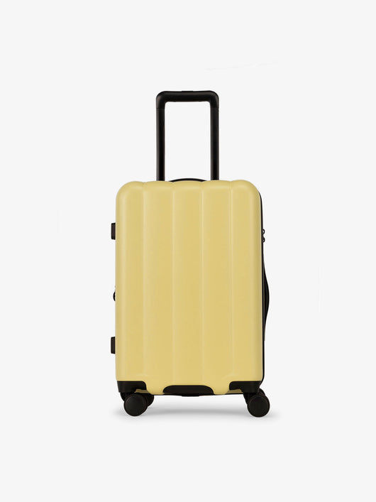 CALPAK Pacific blue carry-on luggage made from an ultra-durable polycarbonate shell and expandable by up to 2" in butter; LCO1020-BUTTER