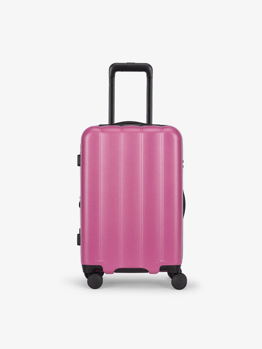CALPAK Pacific blue carry-on luggage made from an ultra-durable polycarbonate shell and expandable by up to 2" in raspberry; LCO1020-RASPBERRY