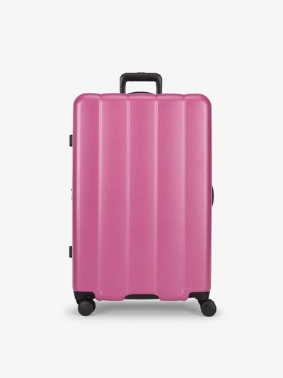 CALPAK raspberry large luggage made from an ultra-durable polycarbonate shell and expandable by up to 2"; LCO1028-RASPBERRY