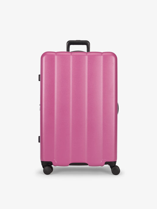 CALPAK raspberry large luggage made from an ultra-durable polycarbonate shell and expandable by up to 2"; LCO1028-RASPBERRY