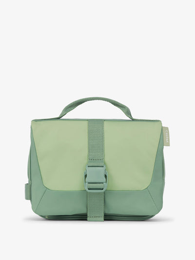 Front view of CALPAK Fit Hanging Dopp Kit made of recycled polyester and features a buckle front closure in sage; TFH2401-SAGE, TFH2401-SAGE-GRIN