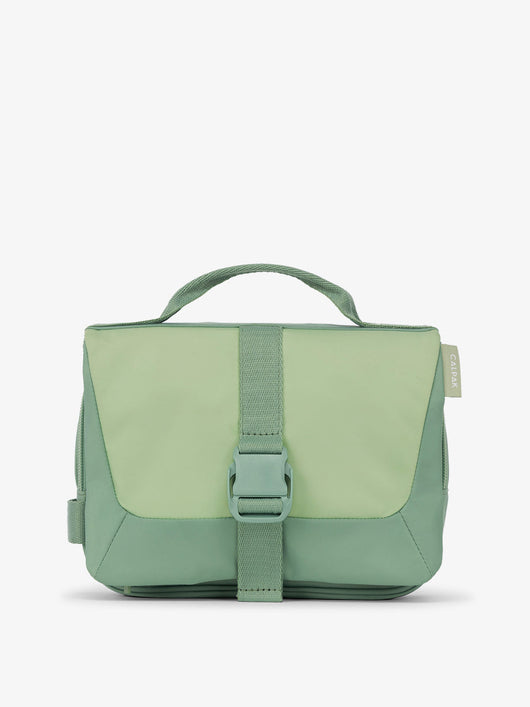Front view of CALPAK Fit Hanging Dopp Kit made of recycled polyester and features a buckle front closure in sage; TFH2401-SAGE, TFH2401-SAGE-GRIN