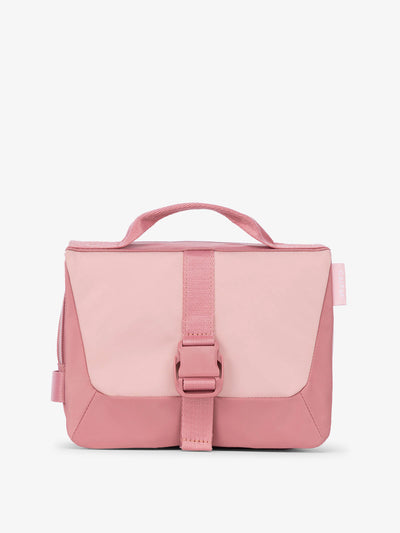 Front view of CALPAK Fit Hanging Dopp Kit made of recycled polyester and features a buckle front closure in tea rose; TFH2401-TEA-ROSE, TFH2401-TEA-ROSE-GRIN
