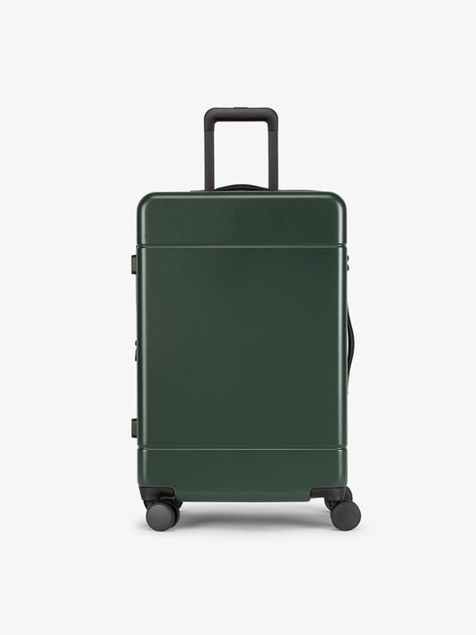 CALPAK Hue Medium 26 inch hardside Luggage front view in green Emerald; LHU1024-EMERALD