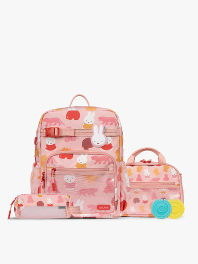 Colorful CALPAK + Miffy Kids Essentials Set with children's Large backpack, lunch bag , pencil case set on a white background with pink accents and Miffy with other animals; BCKL5000-MIFFY-PINK-ZOO-TRIP