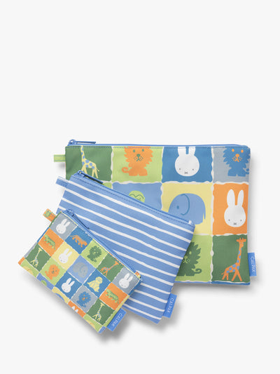 Set of blue, white, green, and yellow colorful children's pouches with Miffy and animal patterns for the CALPAK Compakt Zip Pouch Set on a white background; KZB2001-MIFFY-BLUE-ZOO-TRIP