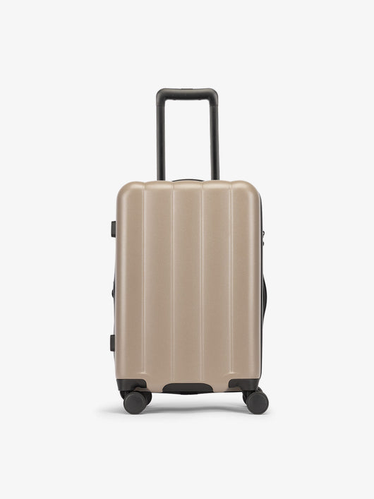 Brown chocolate CALPAK carry-on luggage made from an ultra-durable polycarbonate shell and expandable by up to 2"; LCO1020-CHOCOLATE