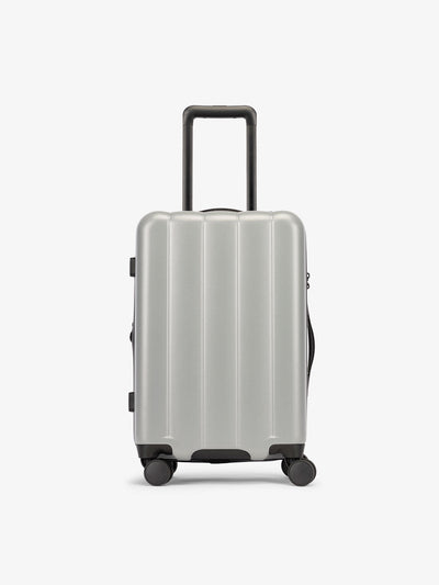 CALPAK Smoke gray carry-on luggage made from an ultra-durable polycarbonate shell and expandable by up to 2"; LCO1020-SMOKE