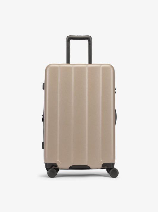 CALPAK Brown chocolate medium luggage made from an ultra-durable polycarbonate shell and expandable by up to 2"; LCO1024-CHOCOLATE