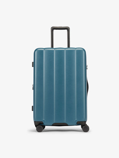 CALPAK Pacific blue medium luggage made from an ultra-durable polycarbonate shell and expandable by up to 2"; LCO1024-PACIFIC