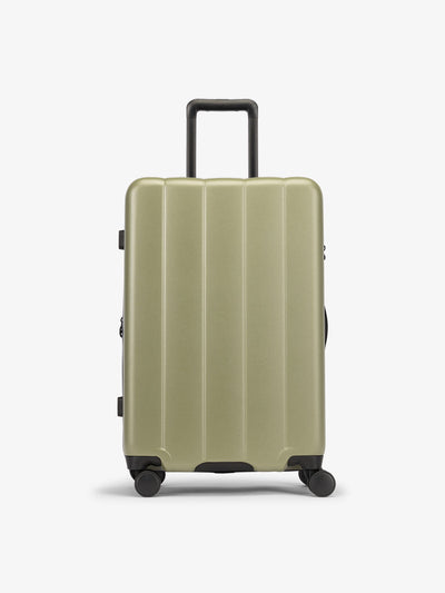 CALPAK Green pistachio medium luggage made from an ultra-durable polycarbonate shell and expandable by up to 2"; LCO1024-PISTACHIO